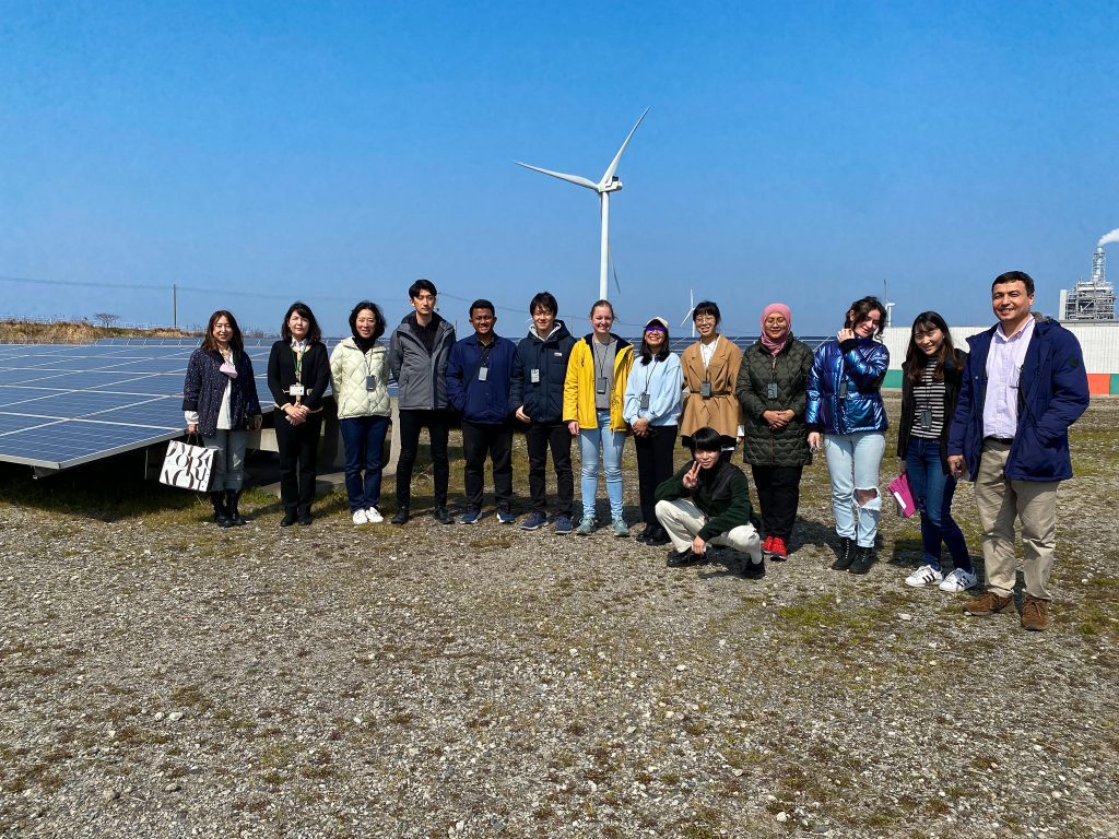 Group Photo in front of Kitakyushu Citizen's Solar Power Plant